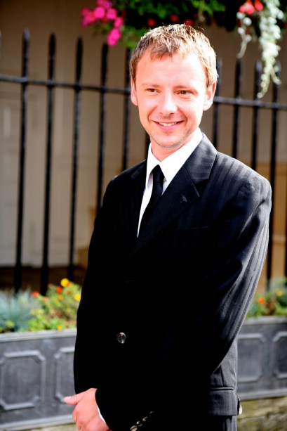 John Simm is a founding member, songwriter and guitarist with the rock band Magic Alex