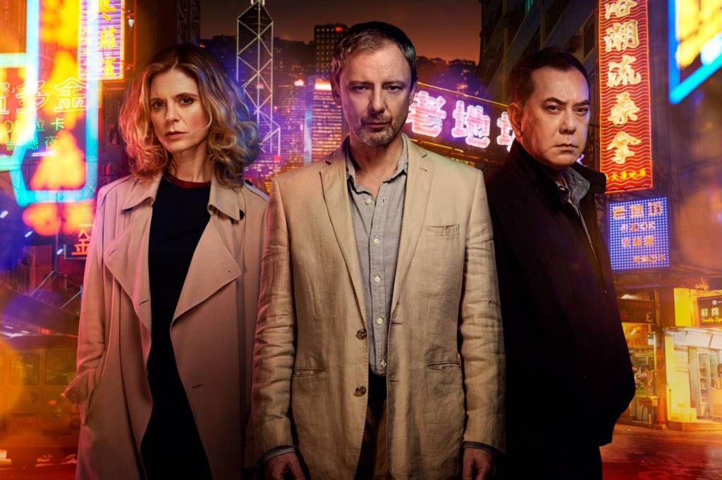 John Simm with co-stars Emilia Fox and Anthony Wong in ITV drama Strangers. Photo: ITV