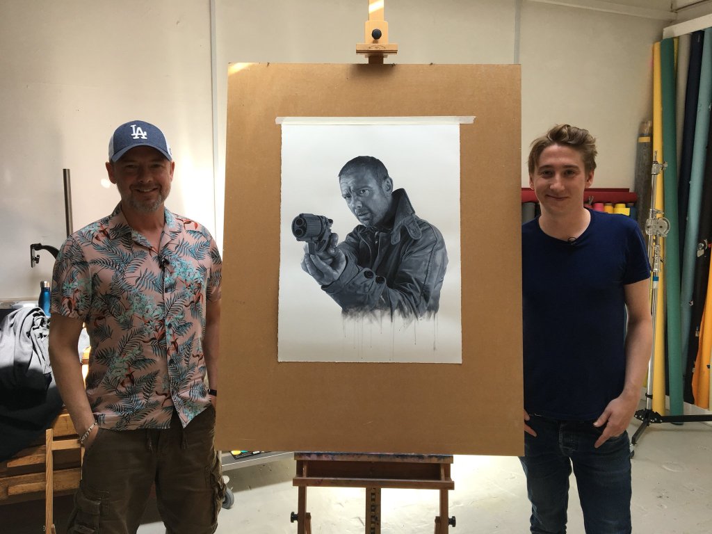 John Simm and artist Joe Simpson with the black and white portrait of John in his chosen role as Rick Deckard from Blade Runner