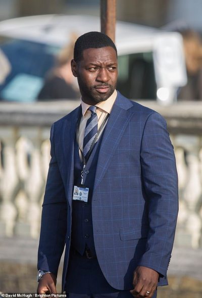 Colleague: Richie (pictured) also put on a dapper display in a dark blue plaid three piece suit, and he completed the outfit by wearing a white shirt and a striped tie Colleague: Richie (pictured) also put on a dapper display in a dark blue plaid three piece suit, and he completed the outfit by wearing a white shirt and a striped tie