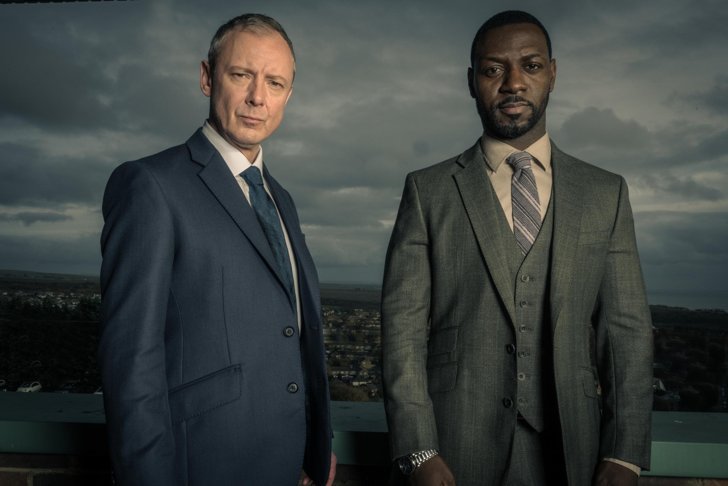 John Simm returns as Detective Superintendent Roy Grace alongside with Richie Campbell as DS Glenn Branson. Production begins in Brighton this Spring | Photo: ITV John Simm returns as Detective Superintendent Roy Grace alongside with Richie Campbell as DS Glenn Branson. Production begins in Brighton this Spring | Photo: ITV